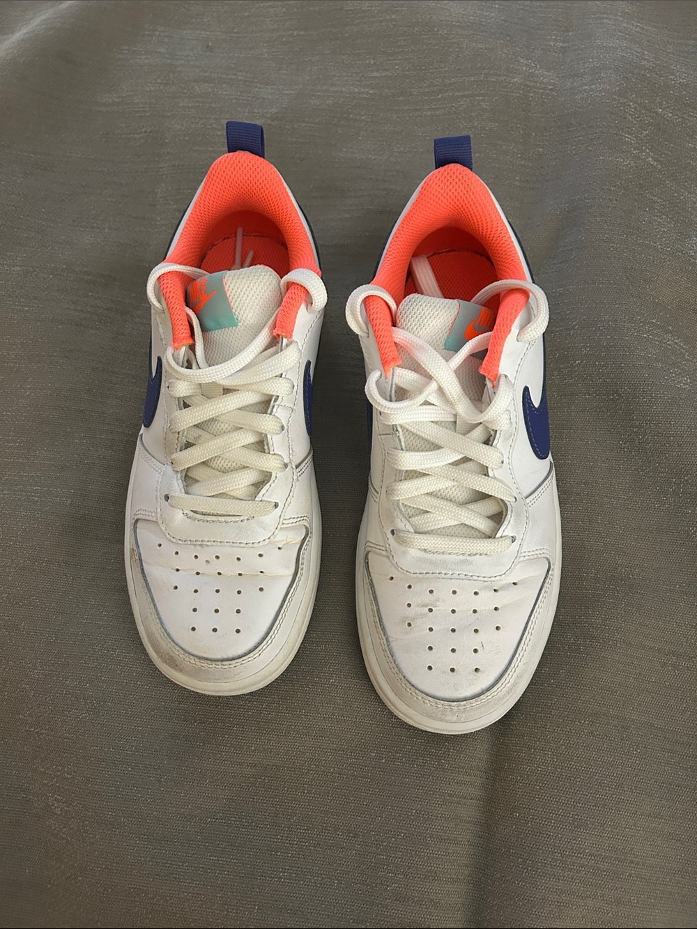 Nike Kids White Sneakers with Navy Swoosh and Coral Lining
